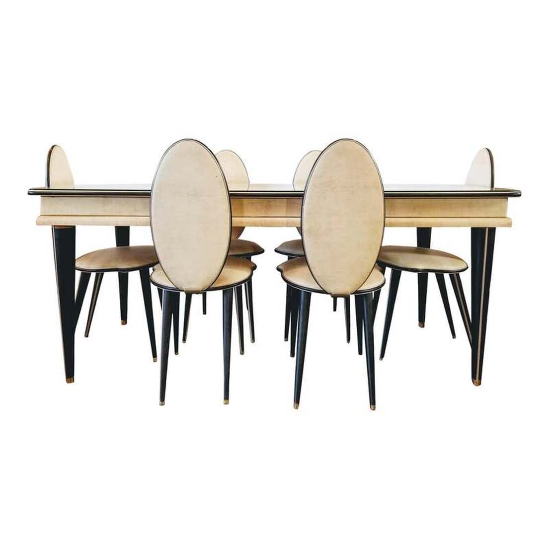 Dining Table and Six Chairs Designed by Umberto Mascagni in Bologna, Italy in 1952. Imported exclusively by I. Barget, Ltd, London. Sold at Harrods London through the 1950s. Constructed with materials considered provocative in the post-war decade : Faux Leather