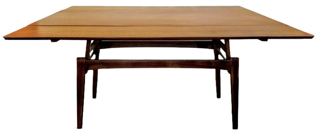Kai Kristiansen Elevator table designed in 1962 for Trioh, Denmark. Table shown in elevated position with leaves drawn for dining and gaming.