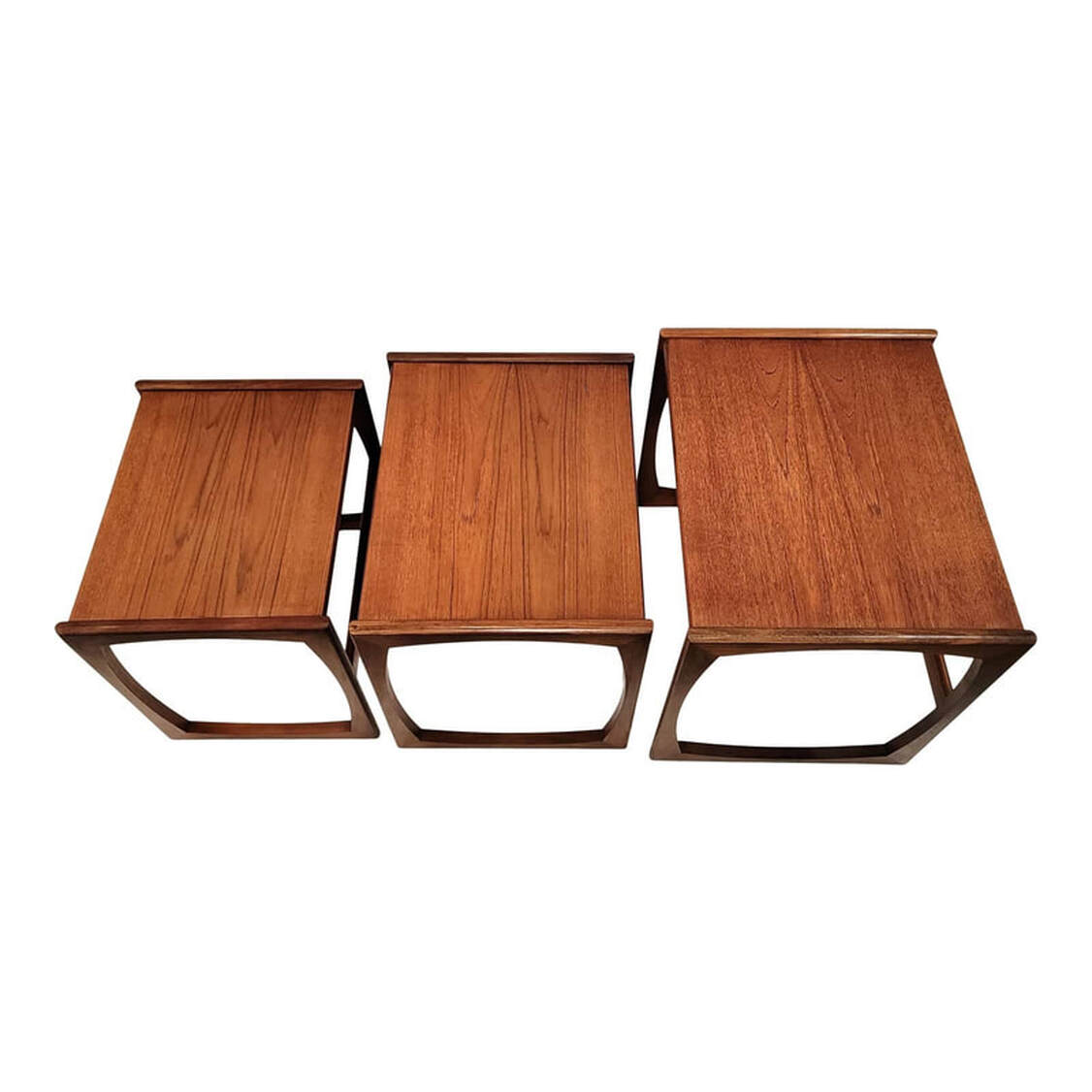  Set of three Mid-Century Modern nested side tables designed by Roger Bennett for G-Plan. Southeast Asian teak wood tops above African afrormosia wood bases. Open square sides, rectangular tops.