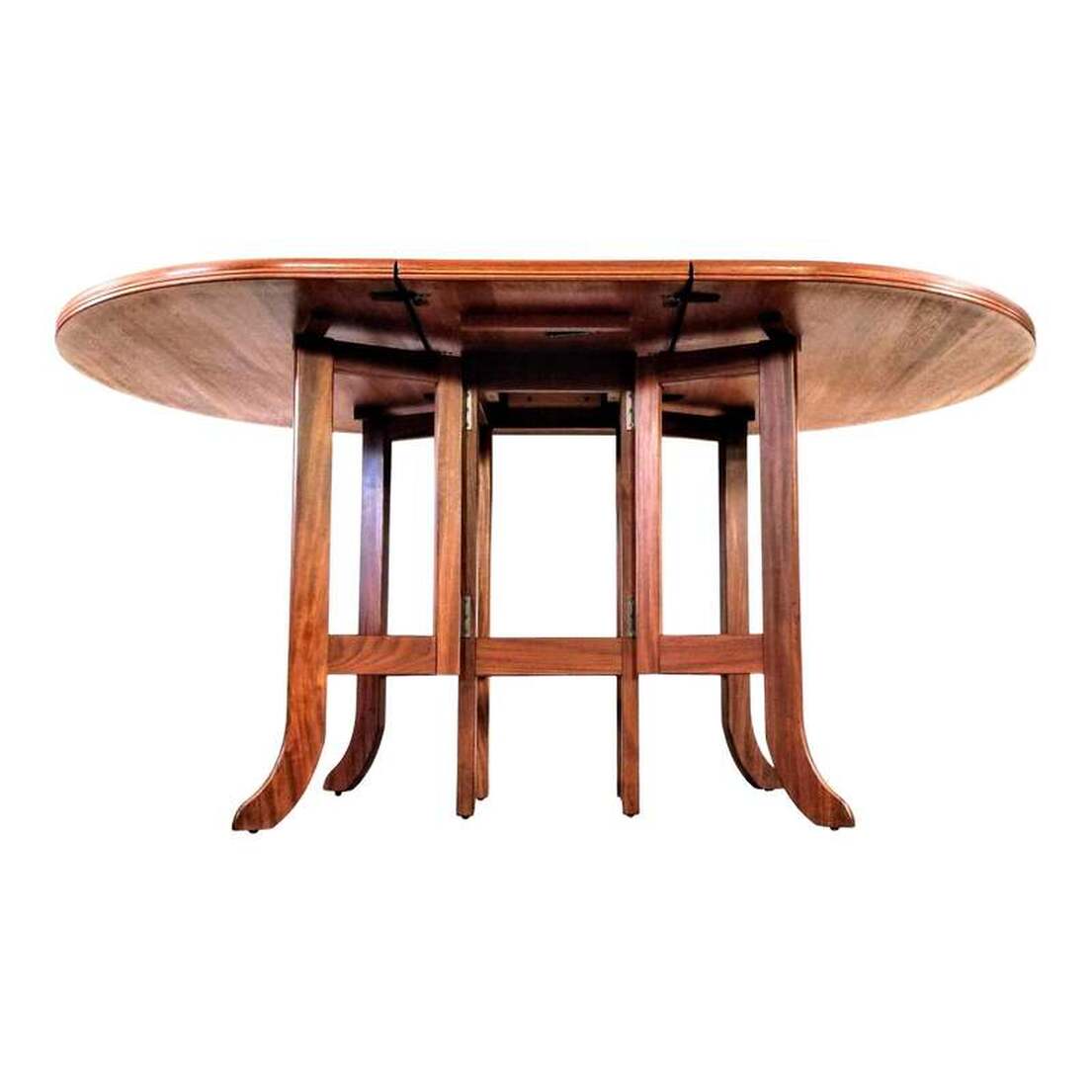 Parker-Knoll / Nathan / Cornwell Parker Mid-Century Modern dining table. The deep-rimmed oval top is manufactured with new growth Southeast Asian crown cut teak with teak crossbanding. The legs are made from African afrormosia wood. The legs at center are straight and the four gatelegs end in a slipper foot.