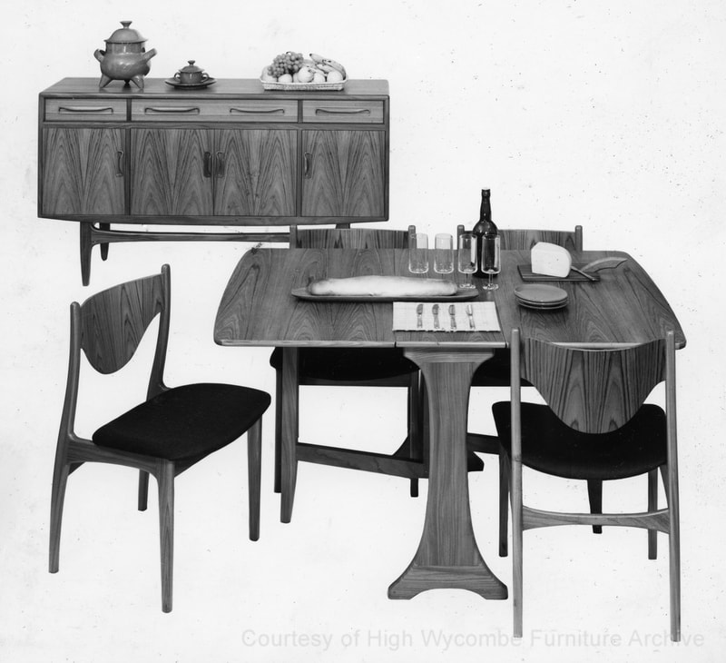 Black and white photograph showing the E. Gomme G-Plan Fresco Dining Range with teak finish: Sideboard (4072), Gateleg Table (4389), Dining Chair (4538) as shown in the G-Plan New Models Folder 1969. 