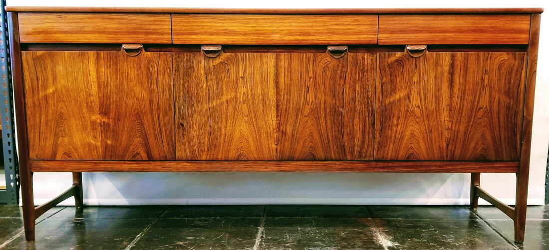 B&I Nathan 'Caspian' credenza from 1966 of flat cut figured Santos Rosewood with rift cut South American rift cut drawer fronts.