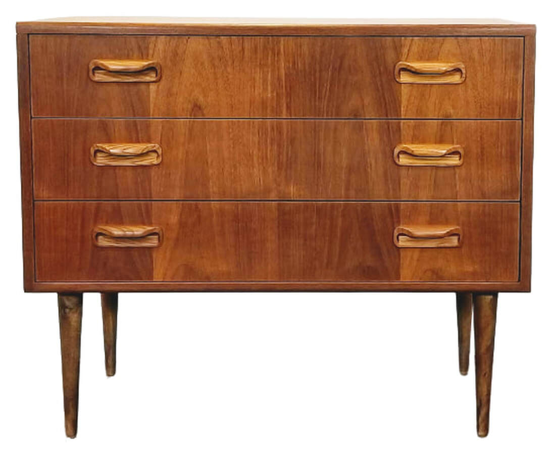 Mid-Century UK Modern three-drawer dressing chest on tapered peg legs designed by V.B. ( Victor Bramwell ) Wilkins for Ebenezer Gomme's G-Plan Fresco Range.  Carcase is teak veneered with African afrormosia wood solids.